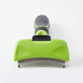Studio main shot of the lime green pet grooming brush on a pure white background